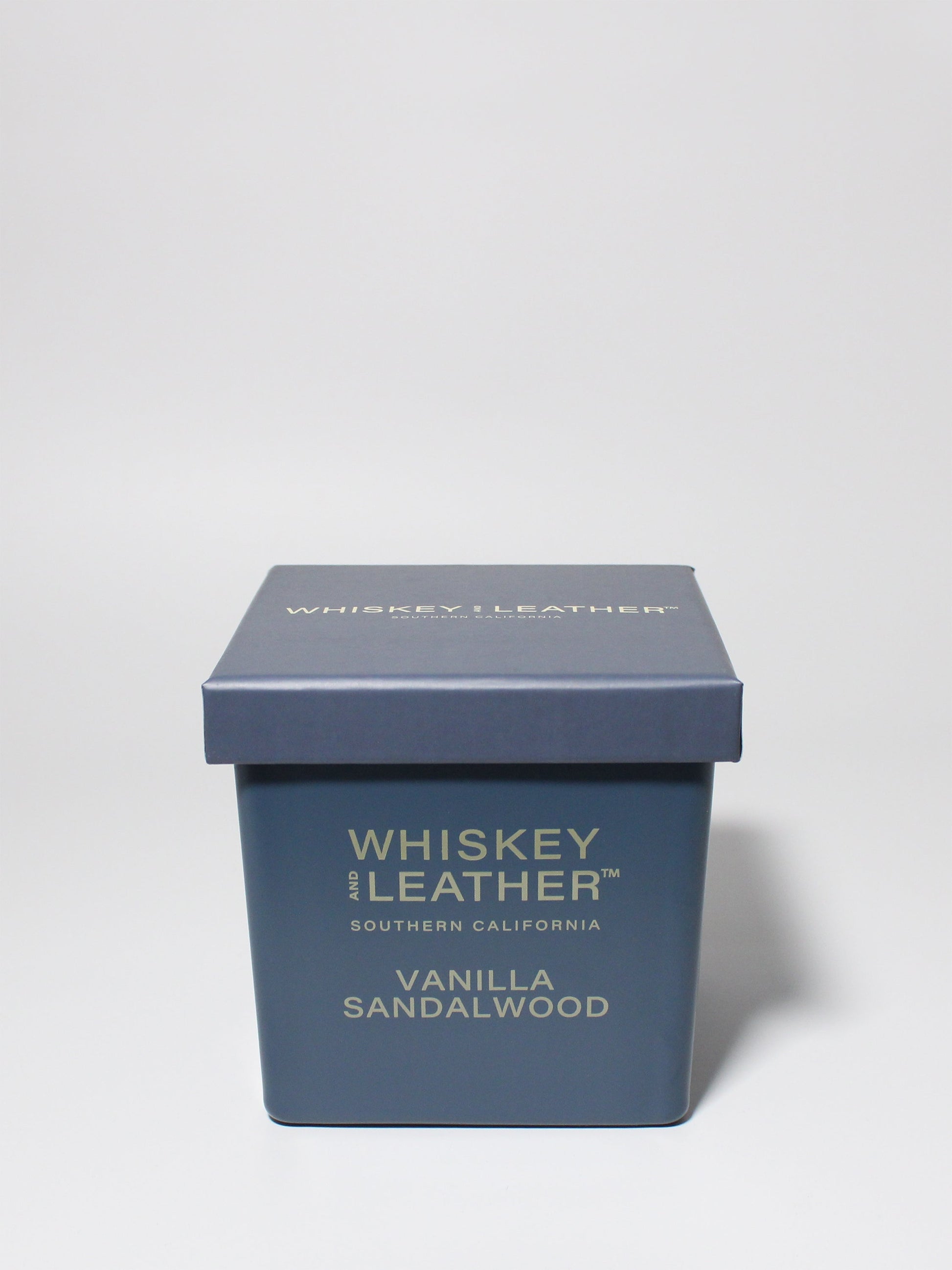 Whiskey and Leather Vanilla Sandalwood 16 oz scented candle Blue vessel with blue lid
