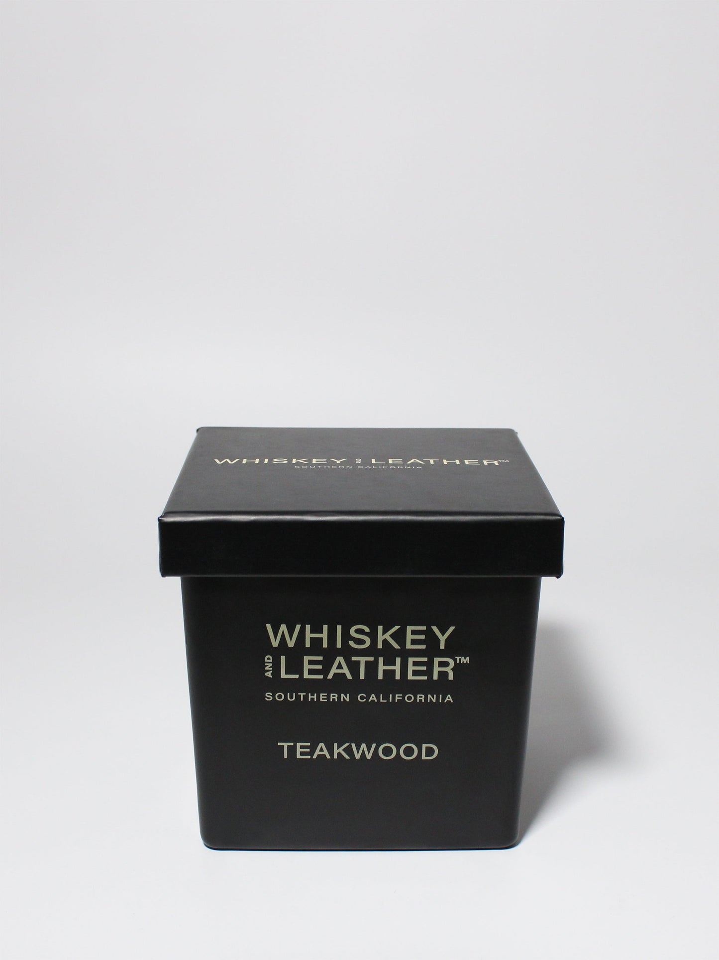 Whiskey and Leather Teakwood 16 oz scented candle Black vessel with black lid