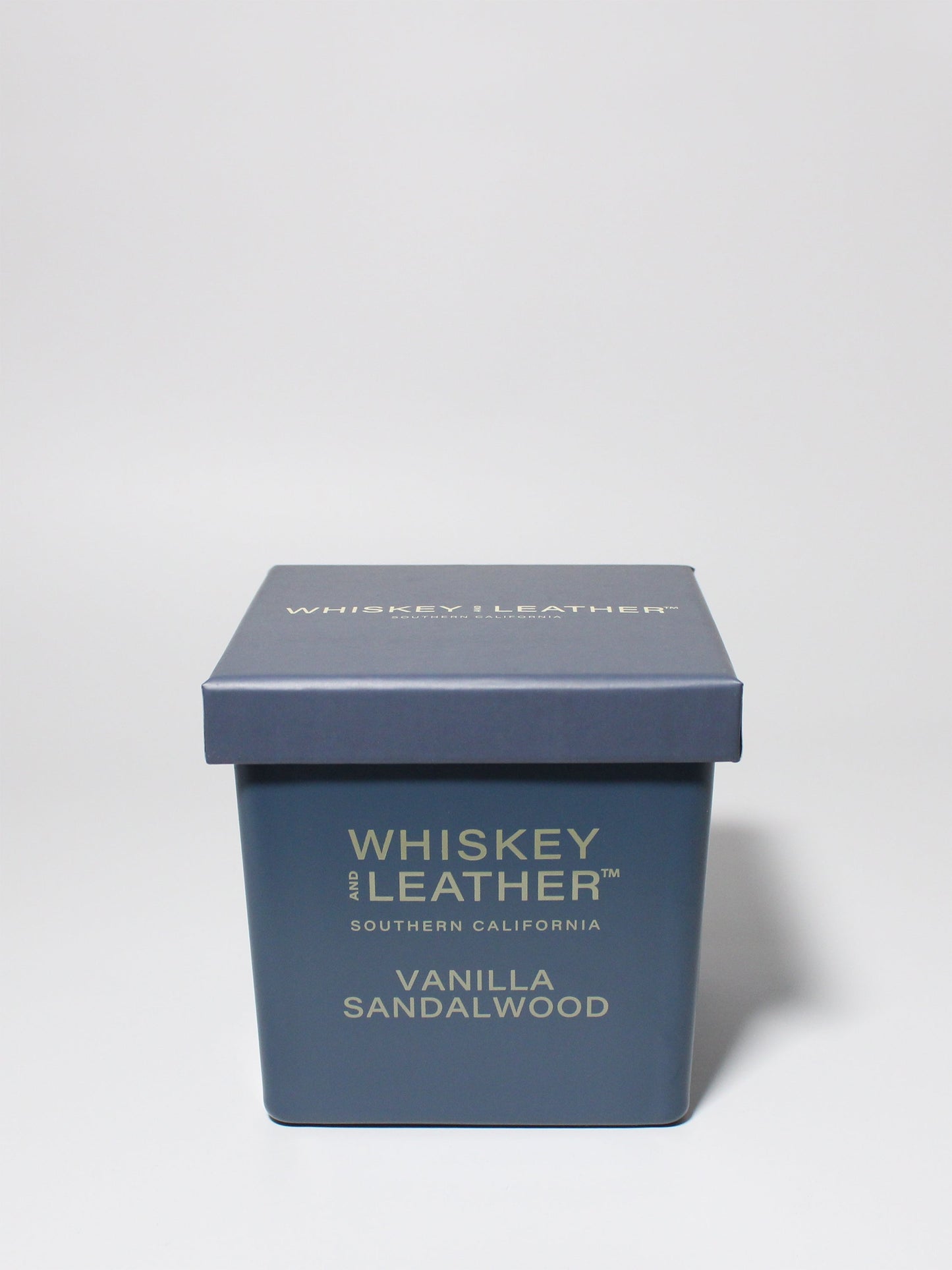 Whiskey and Leather Vanilla Sandalwood 16 oz scented candle Blue vessel with blue lid
