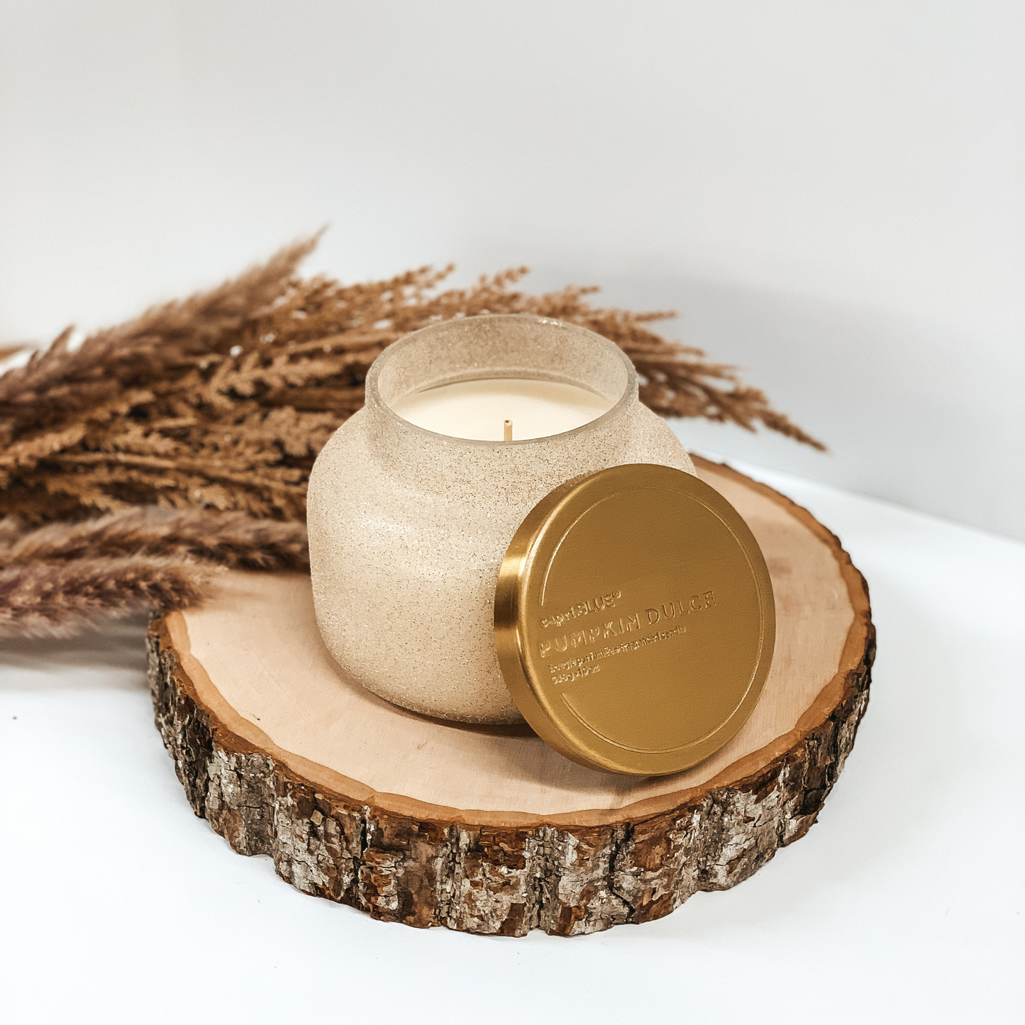 Capri Blue | 19 oz. Jar Candle in Champagne Glitter | Pumpkin Dulce